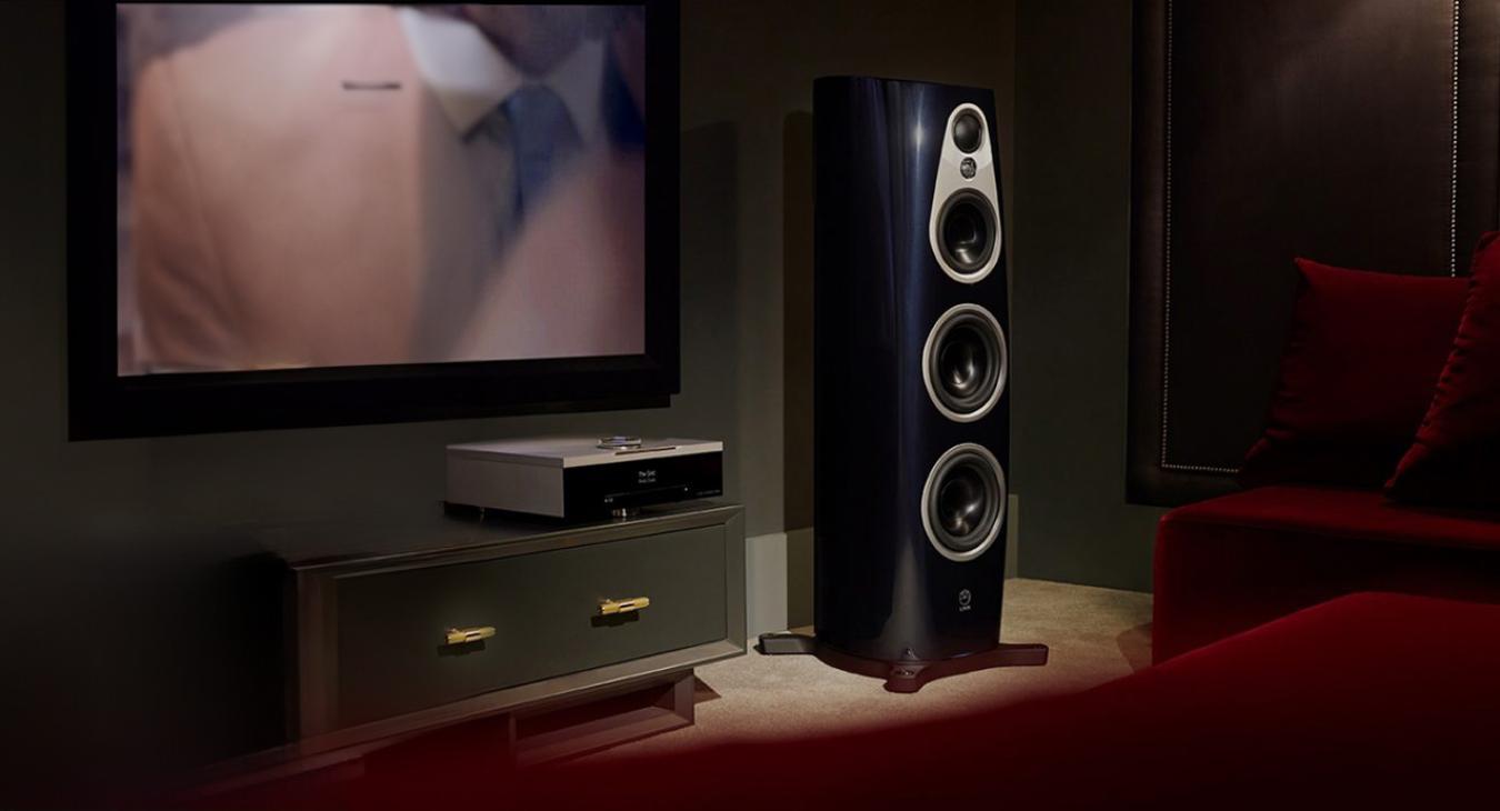 Linn 360 with a DSM on a sideboard unit and a large tv screen on the wall