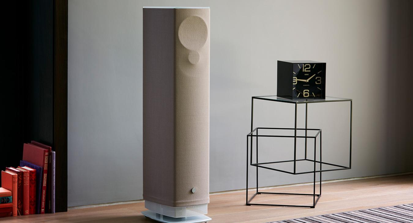 Linn Series 5 530 Exakt Active Loudspeaker in butterscotch in a living area with a white base